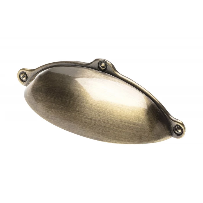 Fém bútorfogantyú, kagyló alakú, szálcsiszolt bronz színben Fém bútorfogantyú, kagyló alakú, szálcsiszolt bronz színben